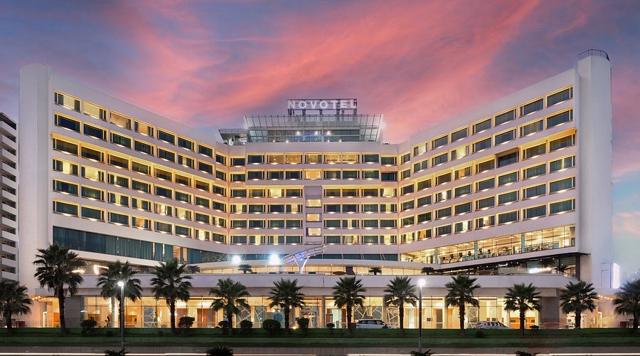 Novotel Visakhapatnam hotel exterior at dusk